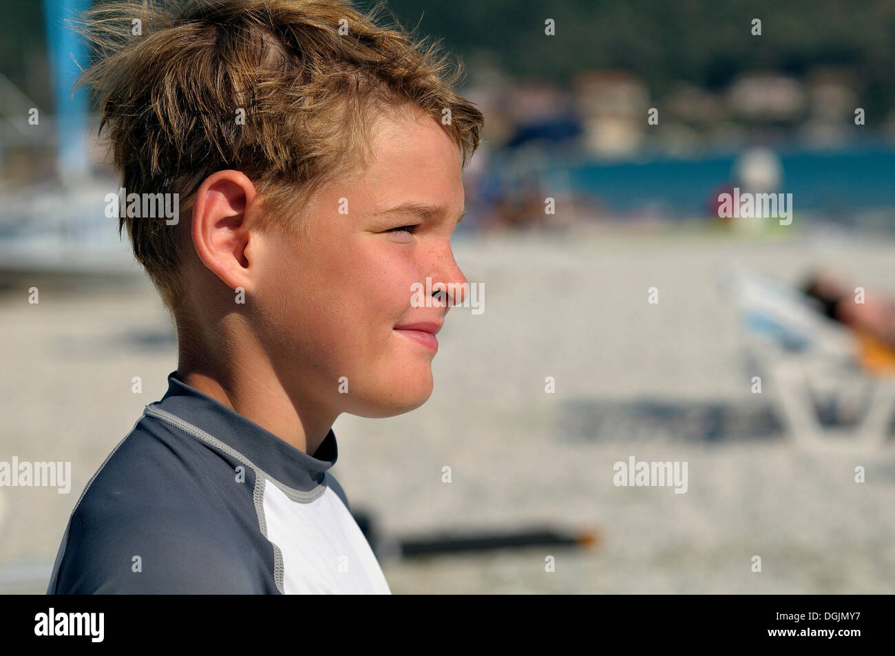 9-year-old boy standing on the beach watching the sea, Vassiliki, Lefkas, Greece, Europe Stock Photo
