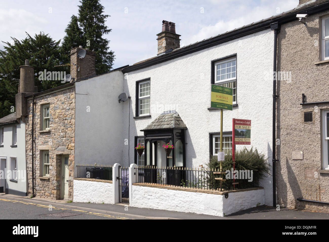 Whitewashed stone cottage for sale on Back Lane, Sedbergh, Cumbria. Stock Photo