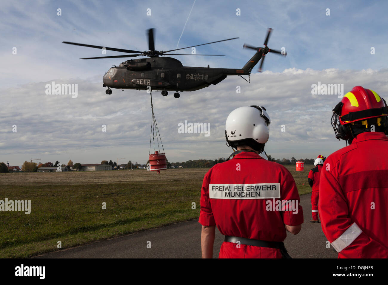 CH53 helicopter carrying a 5000liter water tank during an exercise