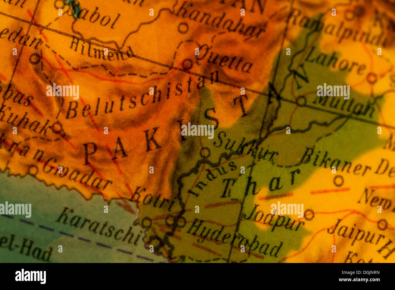 Pakistan, crisis region, illuminated old globe, map section Stock Photo