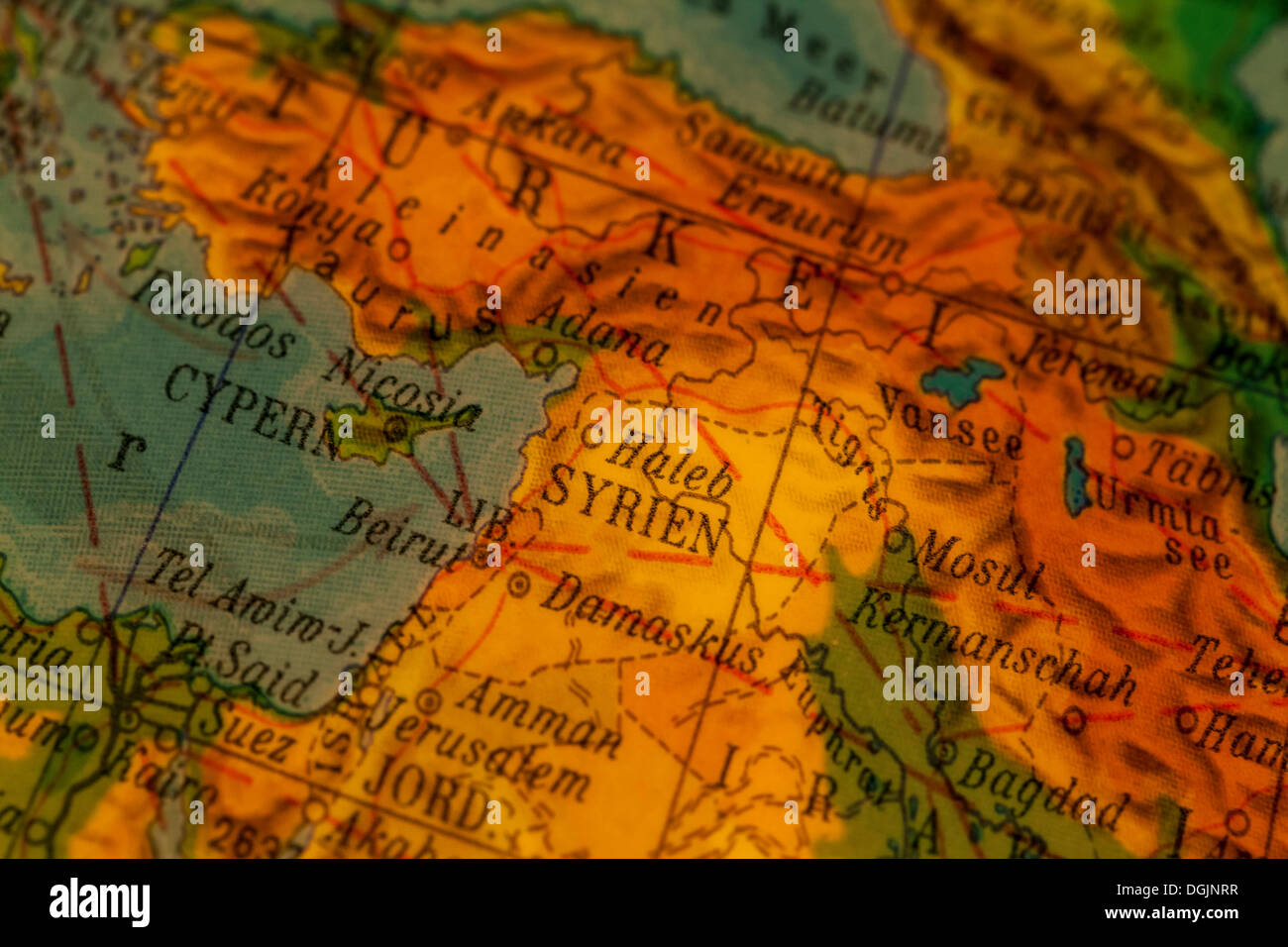 Syria, crisis region, Syrian-Turkish border, illuminated old globe, map section Stock Photo
