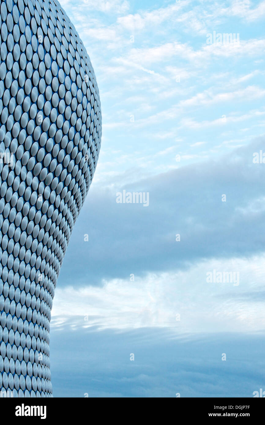 Outline of Selfridges building in Birmingham, UK against blue sky and trailing clouds Stock Photo
