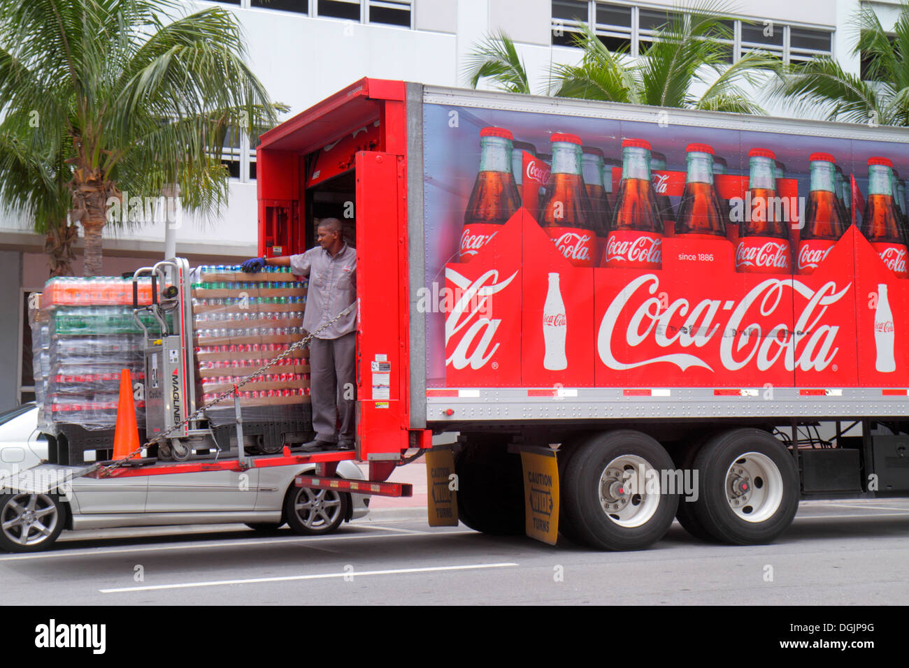 Miami Beach Florida,Collins Avenue,Coca-Cola,delivery,tractor trailer  truck,lorry,Black man men male,driver,job,working,work,tail lift,looking  FL13073 Stock Photo - Alamy