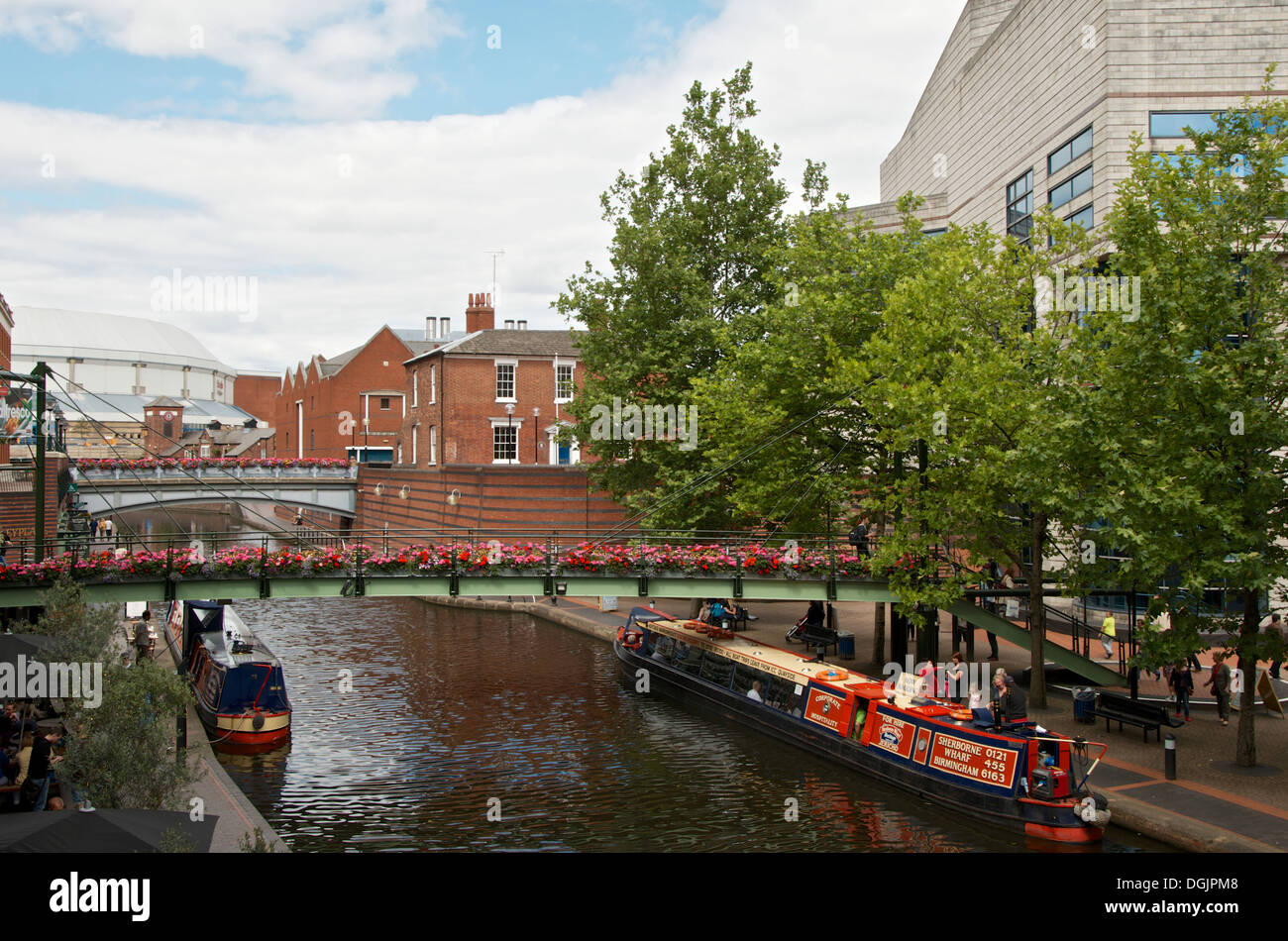 Canal boats at Brindley place Birmingham UK looking toward the International Convention Centre (ICE) Stock Photo