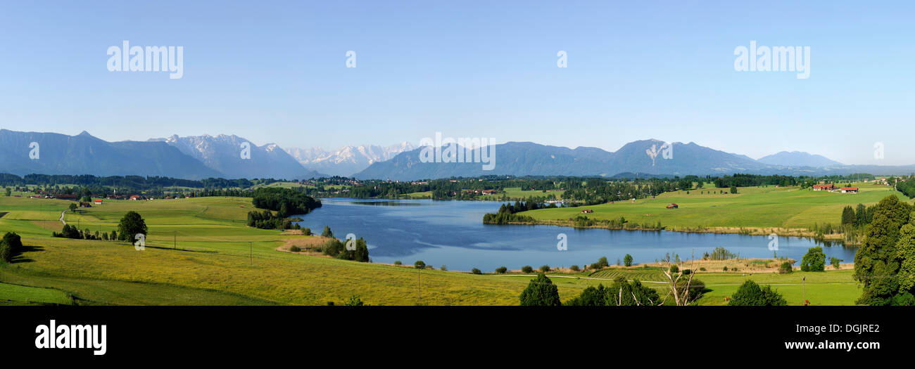 View of lake Riegsee and the Alps as seen from Aidlinger Hoehe, Blaues Land region, Upper Bavaria, Bavaria Stock Photo