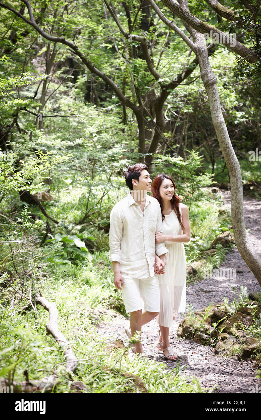 Back view couple walking arms hi-res stock photography and images - Alamy