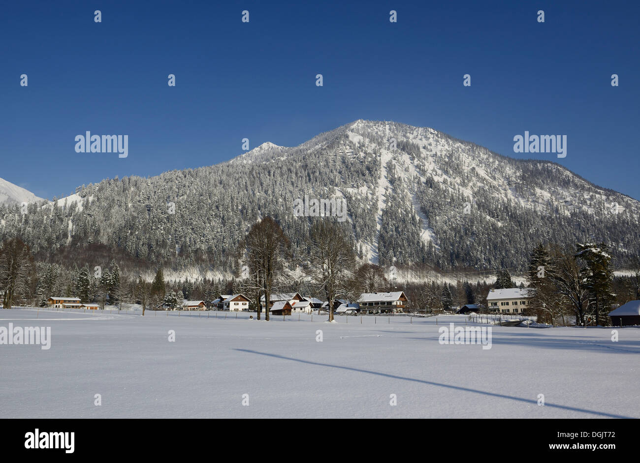 Winter morning in the village of Walchensee, Mount Herzogstand at back, Walchensee, Upper Bavaria, Bavaria, Germany Stock Photo