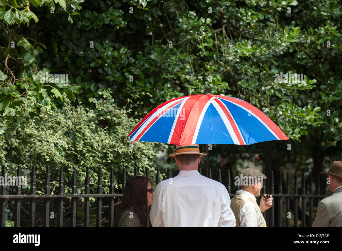 A Union Flag umbrella held in the queue of people waiting to enter Bedford Square Gardens for the start of the Chap Olympiad. Stock Photo