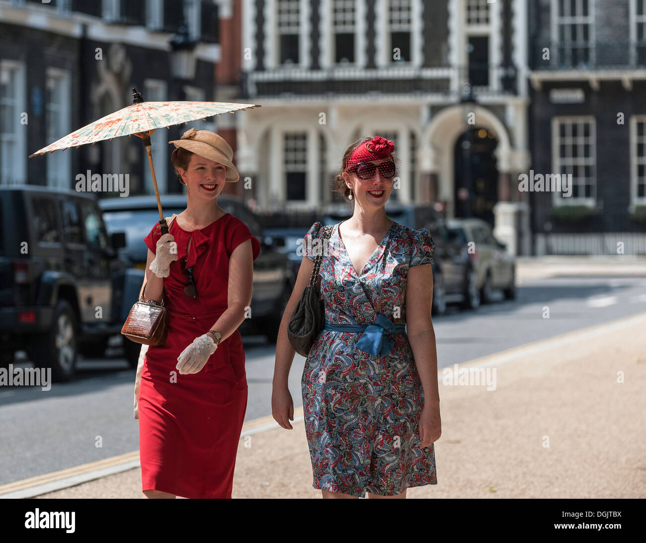 Two ladies in vintage style clothing walking in Bedford Square. Stock Photo