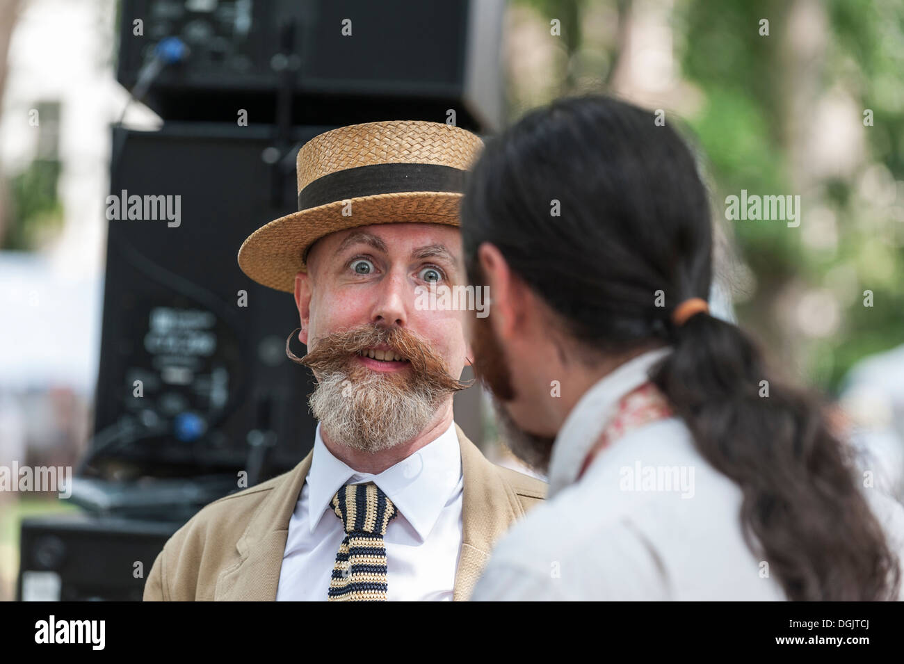A gentleman with a fine moustache and beard waiting for the start of the 2013 Chap Olympiad in Bedford Square Gardens. Stock Photo