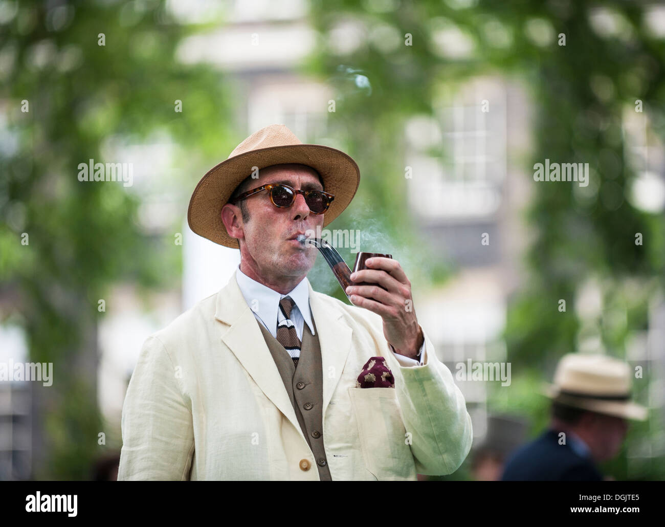Gustav Temple editor of the magazine The Chap smokes the official pipe to mark the opening of the Chap Olympiad in Bedford Squar Stock Photo