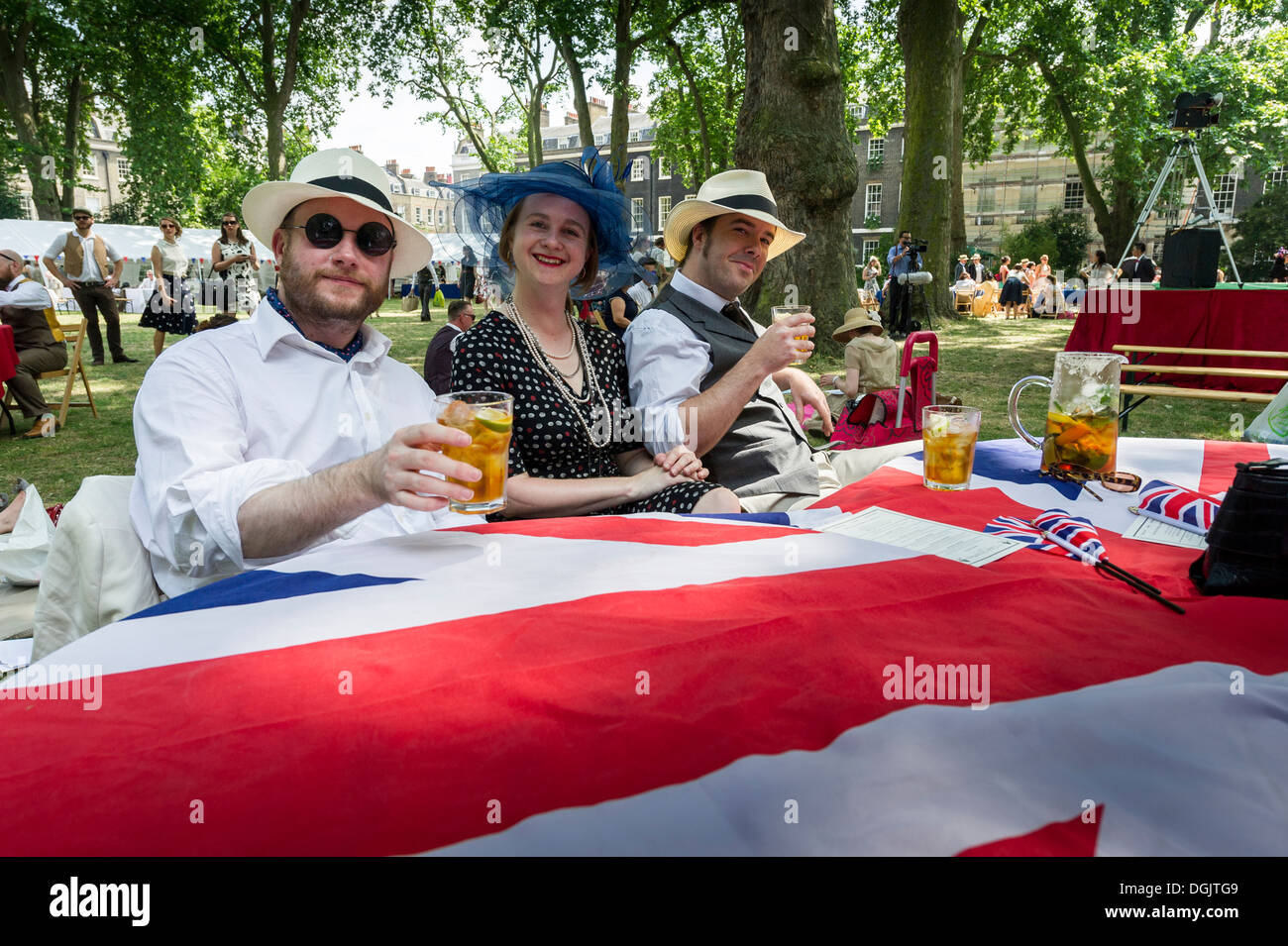 Spectators enjoying their refreshments at the Chap Olympiad in Bedford Square Gardens. Stock Photo