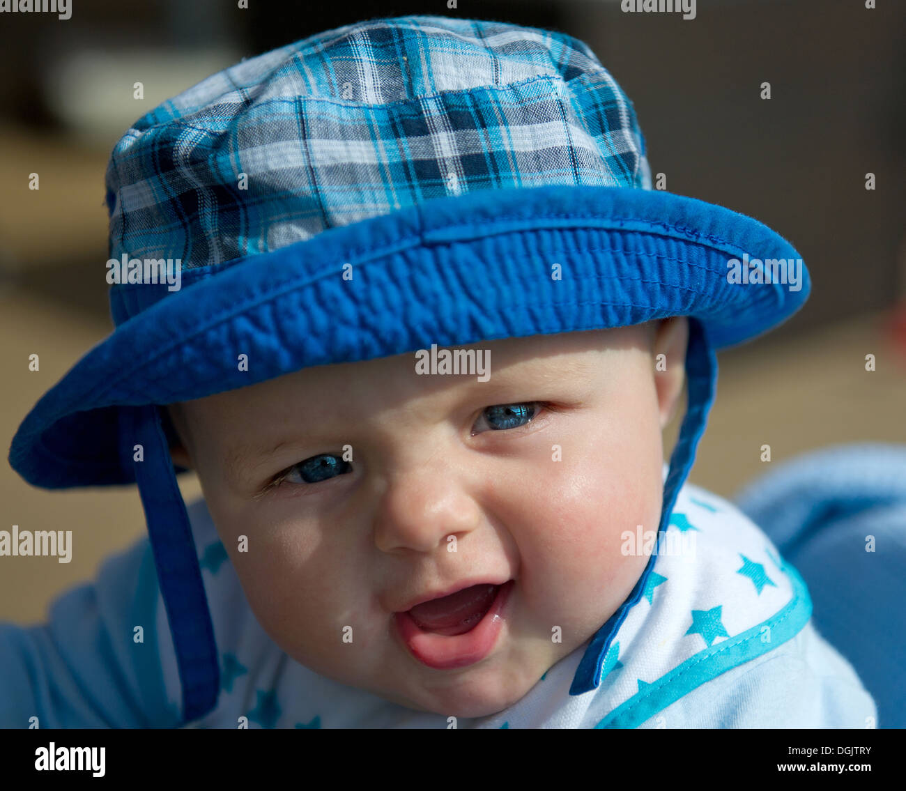 A baby boy in a sun hat. Stock Photo