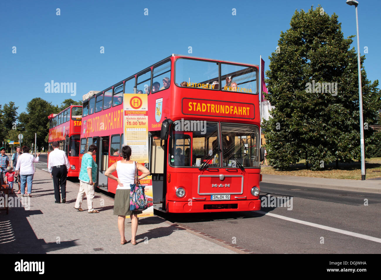 An MAN open top double deck city tour bus waiting at a stop Schwerin Germany Stock Photo