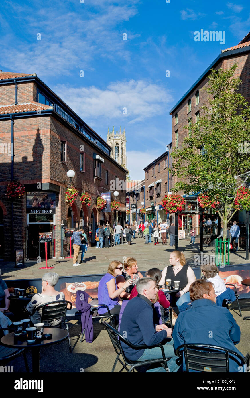 People tourists visitors sitting outside cafe near the Jorvik Viking Centre Coppergate York North Yorkshire England UK United Kingdom Great Britain Stock Photo