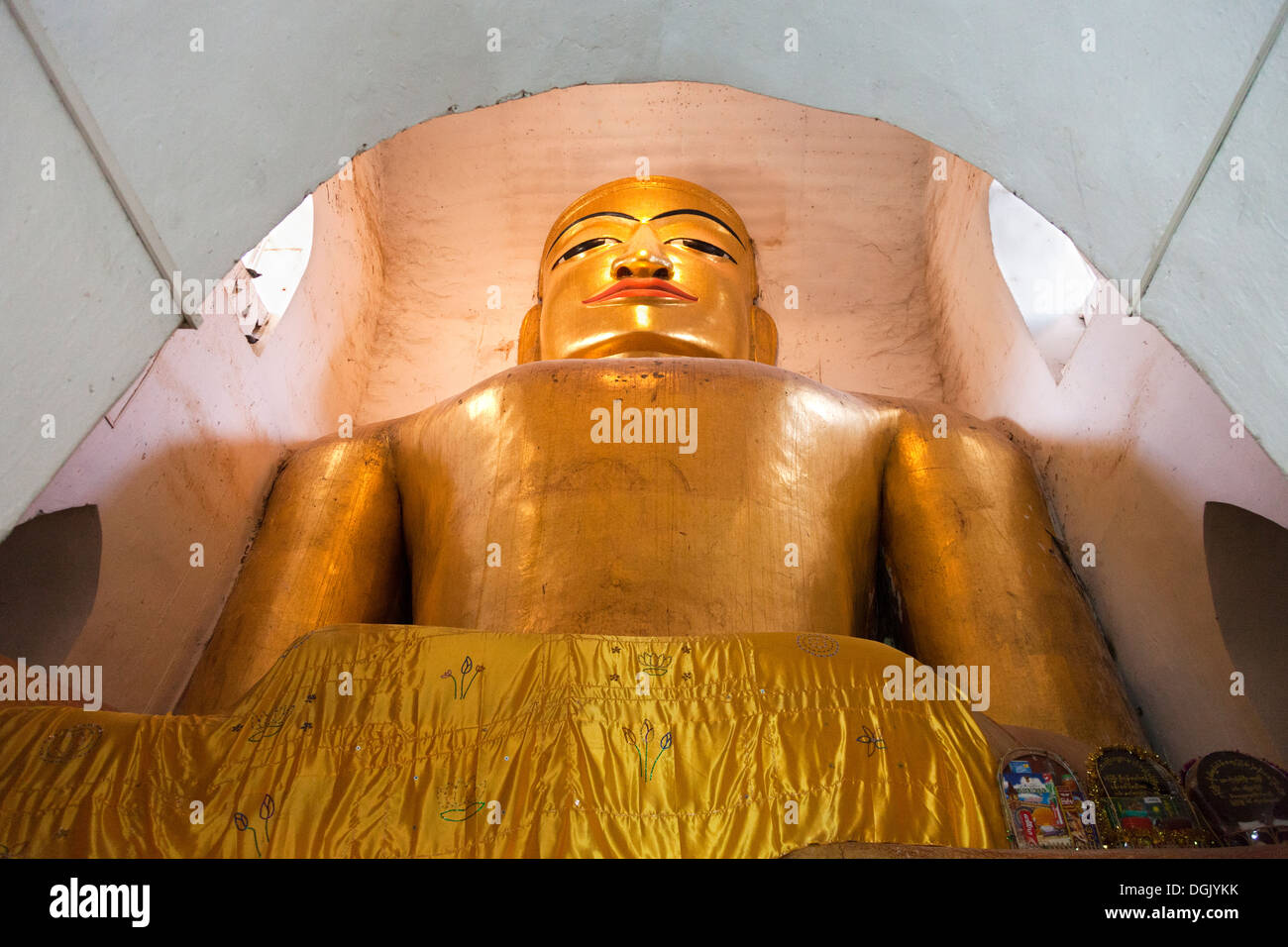 A cramped sitting Buddha in the Manuha Phaya Temple in Bagan in Myanmar. Stock Photo