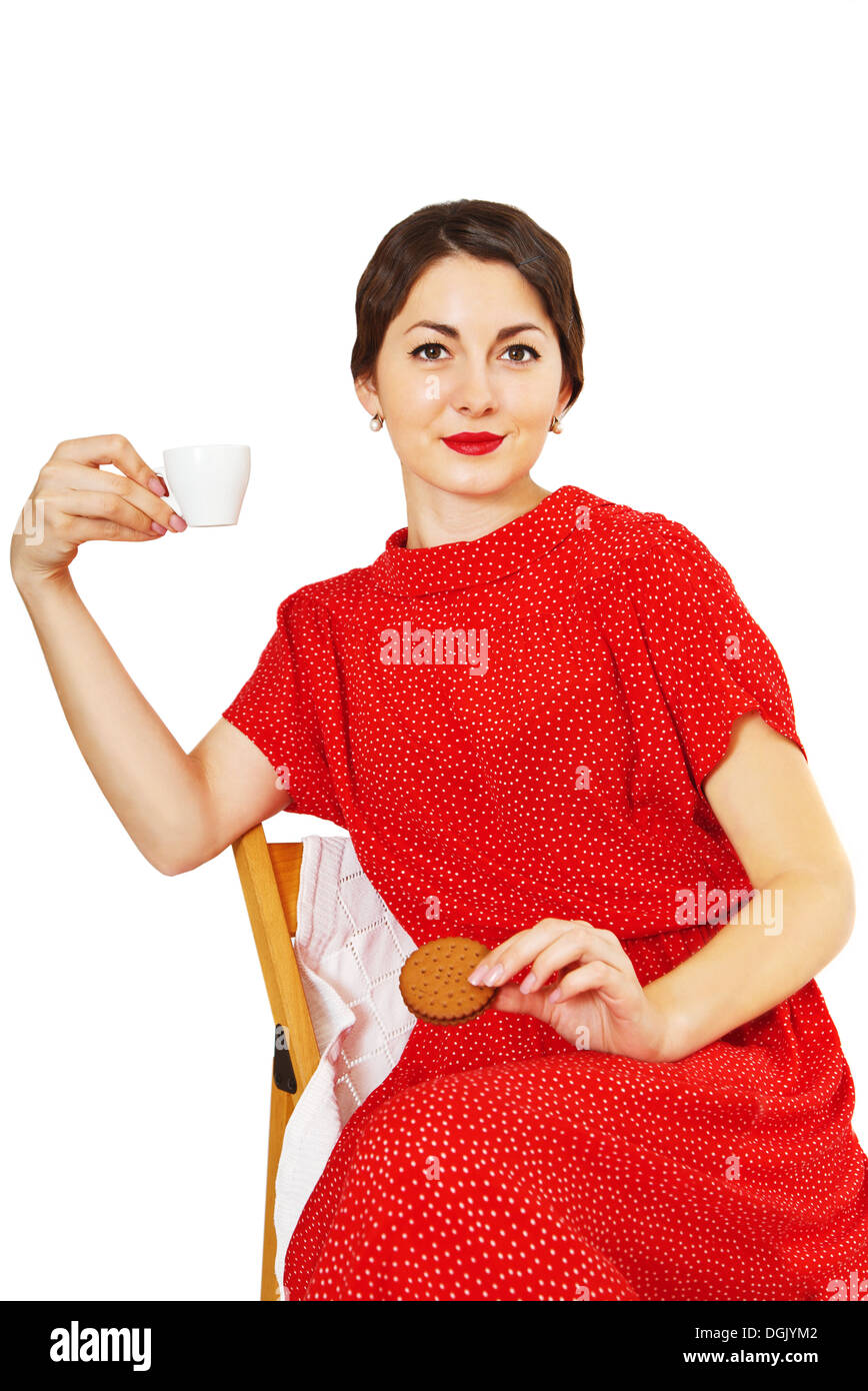 Woman holding a cup of coffee and cookies Stock Photo