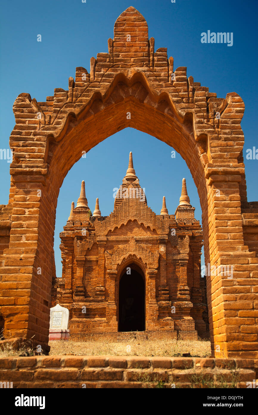 Scene in an archway - Tayokepyay Temple in Bagan in Myanmar. Stock Photo