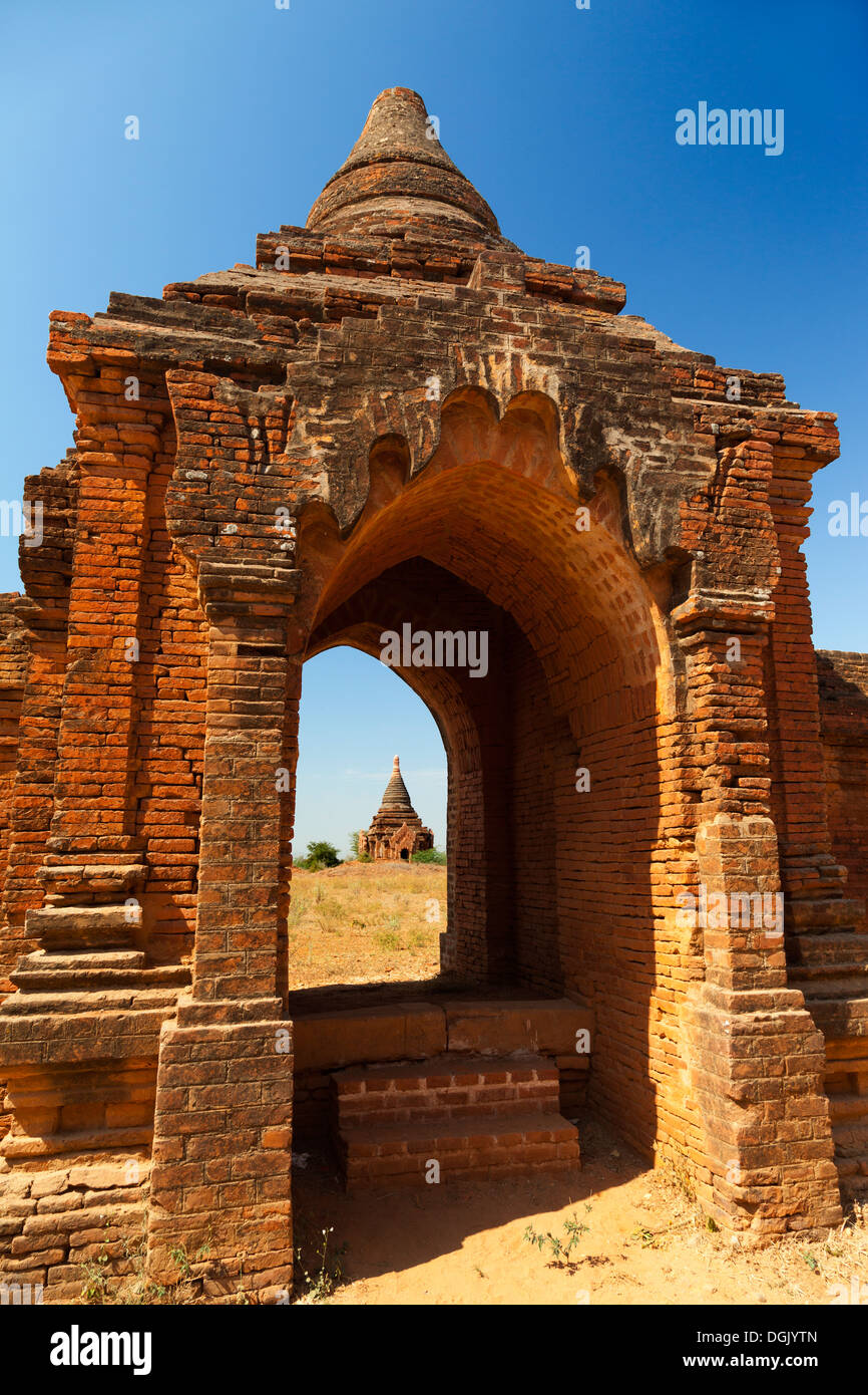 Scene in an archway - Tayokepyay Temple in Bagan in Myanmar. Stock Photo