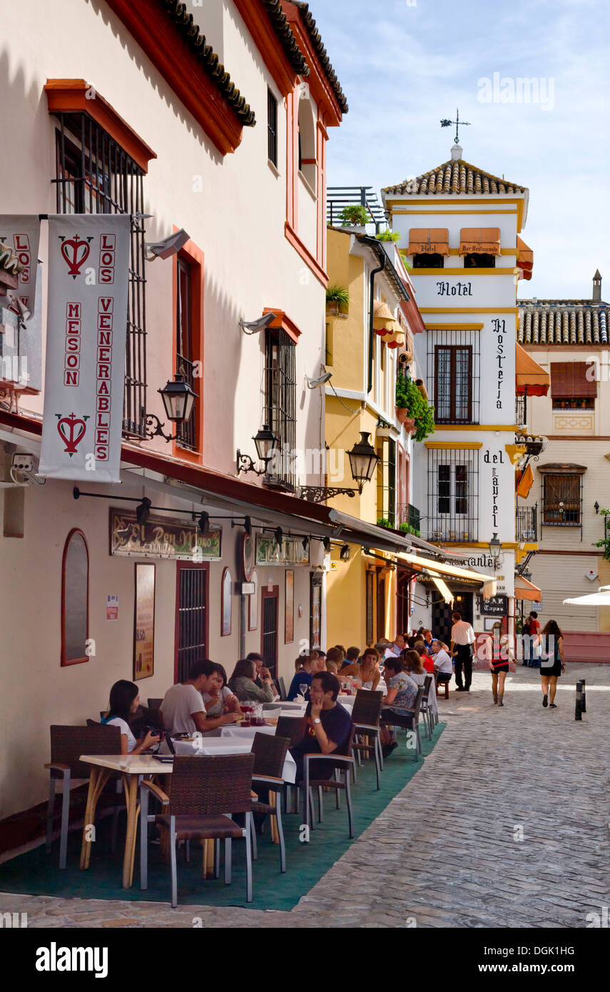 a restaurant in the narrow streets at the Plaza de los Venerables, Barrio santa Cruz, Seville, Andalusia, Spain Stock Photo
