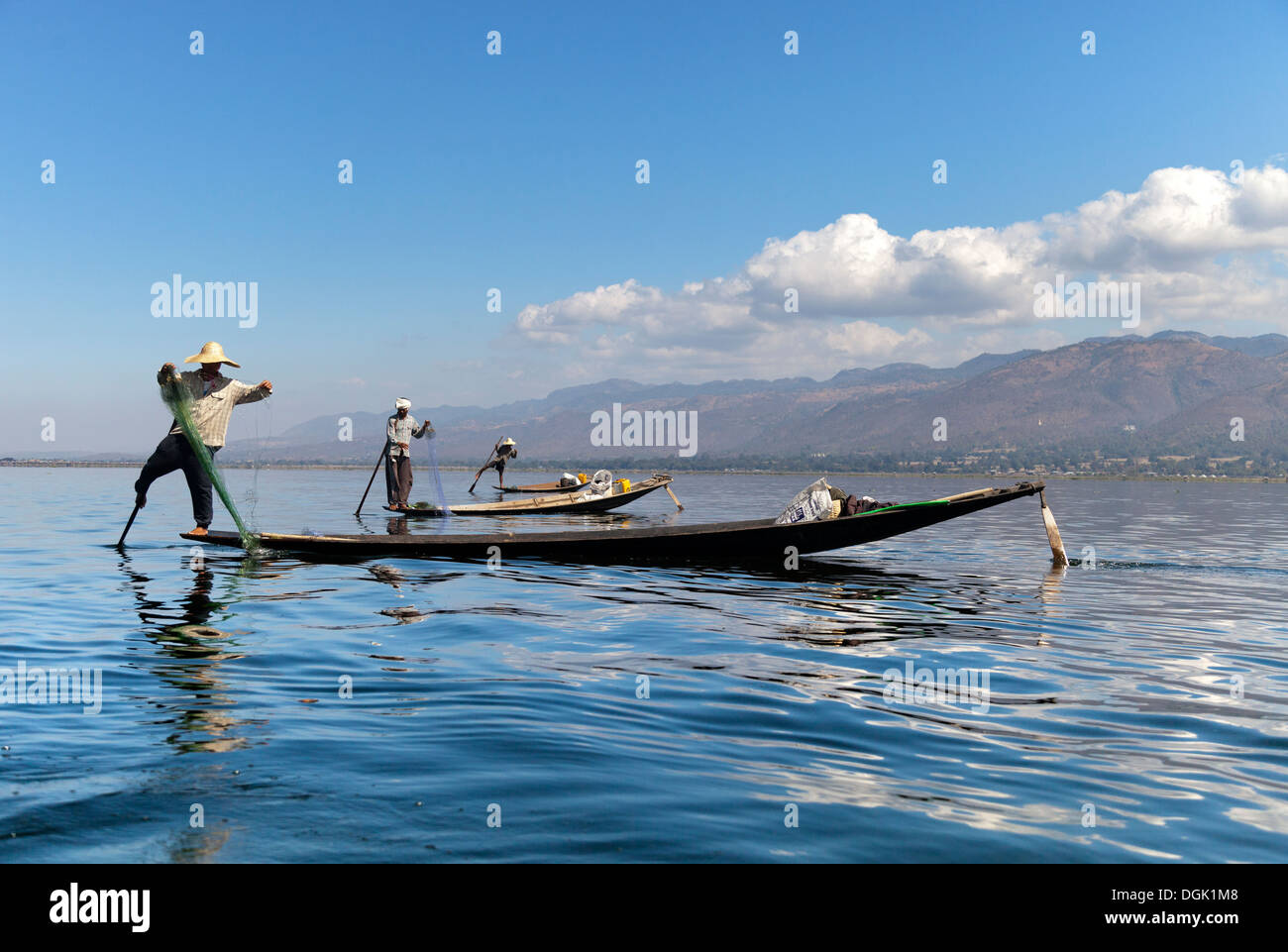 Three fishing boats in a line on Lake Inle in Myanmar. Stock Photo