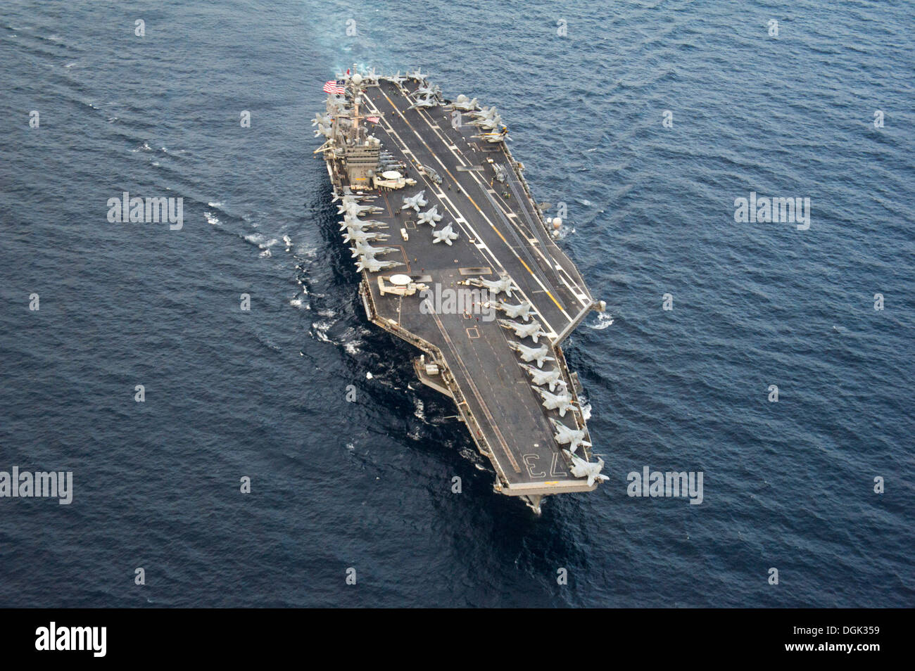 aircraft carrier USS George Washington (CVN 73) patrols the waters to the west of the Korean peninsula. George Washington and its embarked air wing, Carrier Air Wing (CVW) 5, provide a combat-ready force that protects and defends the collective maritime i Stock Photo