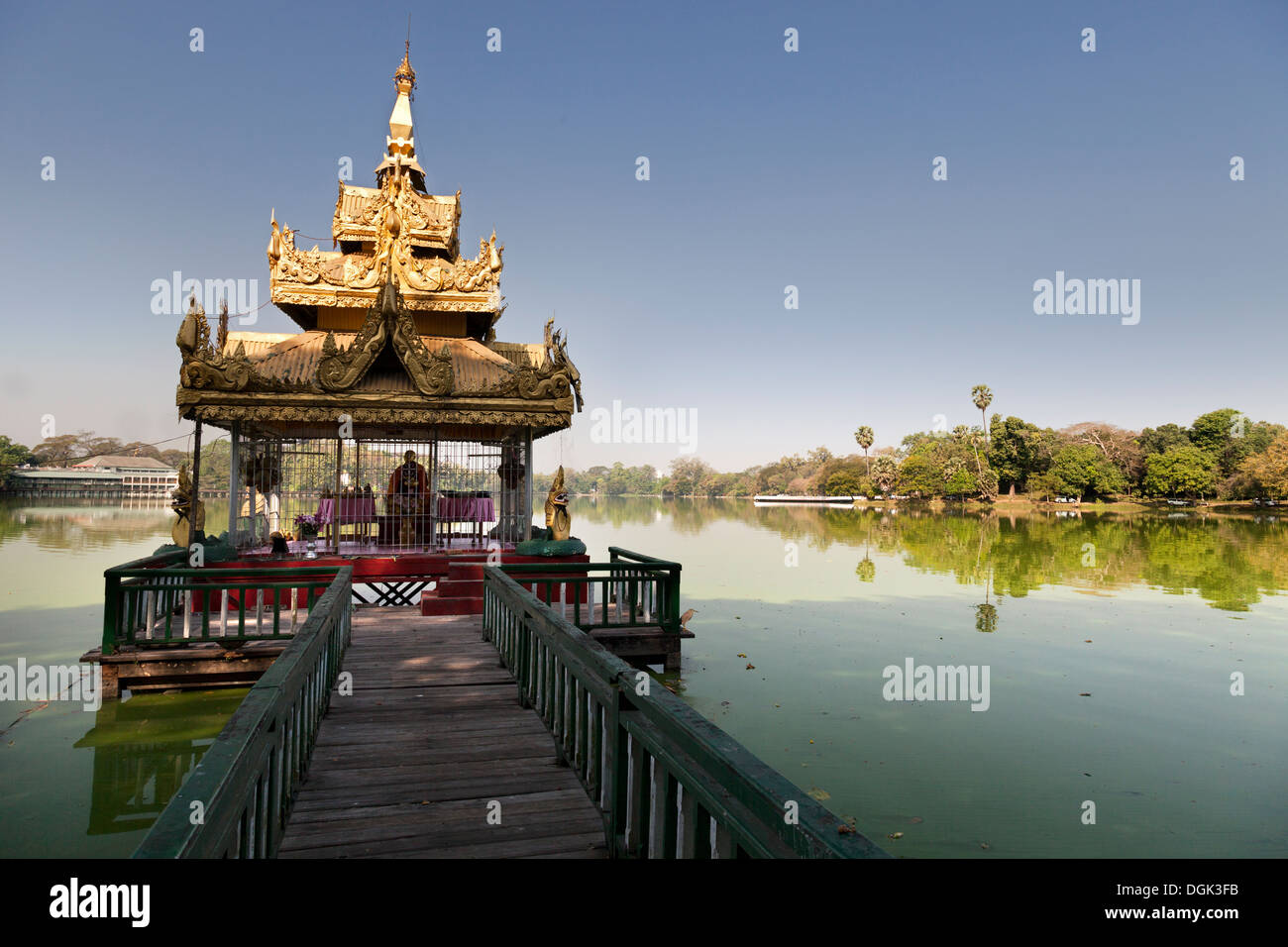 A shady pavilion with crooked spire on Kandawgyi Lake in Yangon in Myanmar. Stock Photo