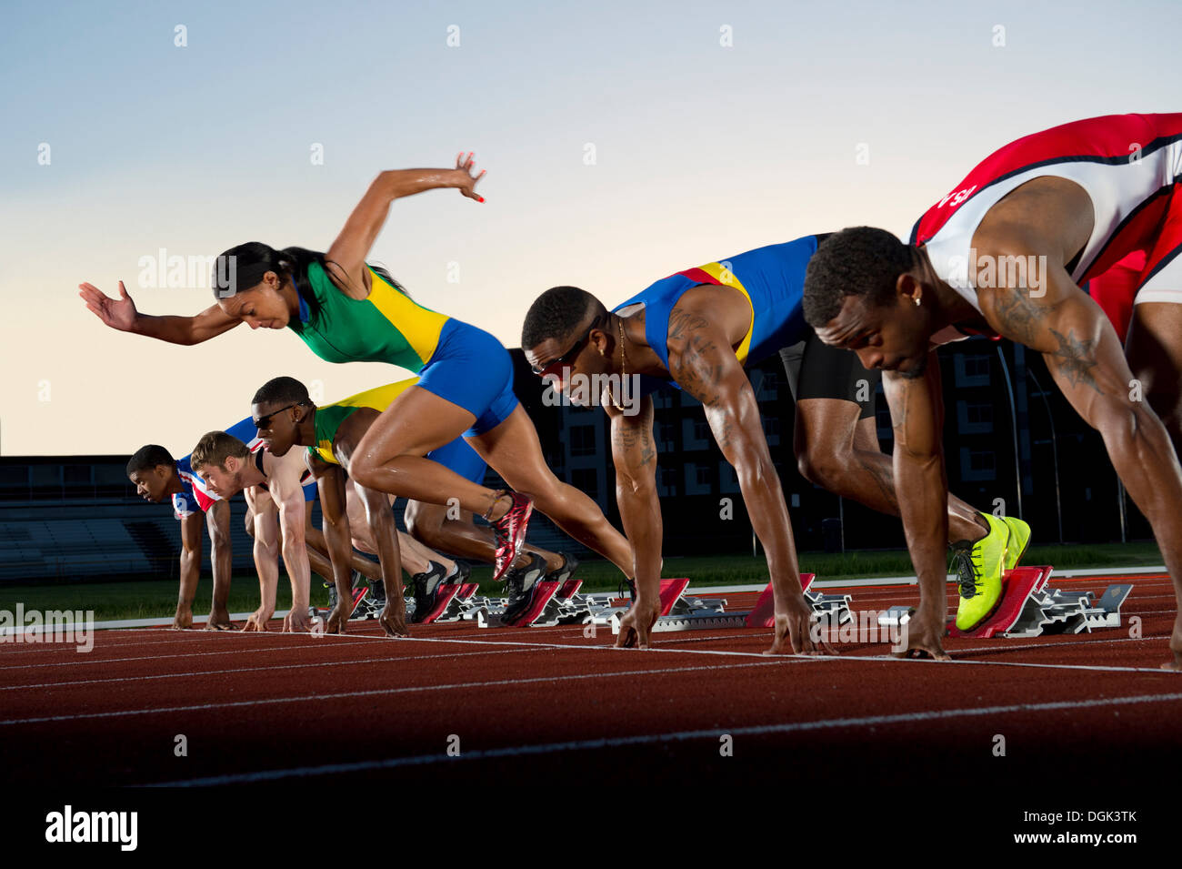 False start in race, woman running against men Stock Photo Alamy