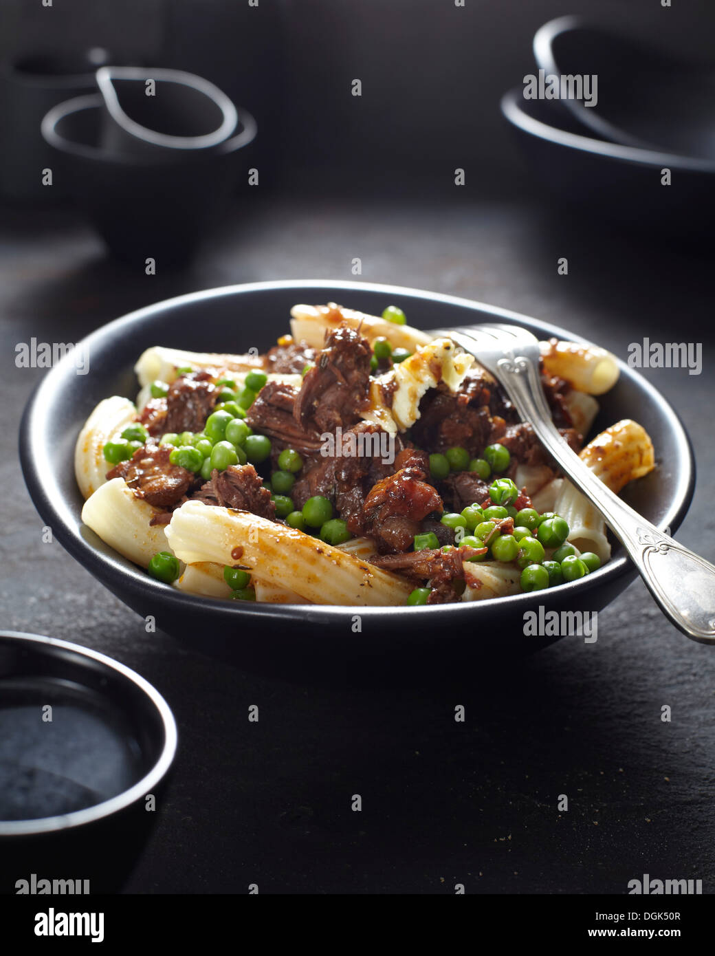 Pasta dish with meat and peas Stock Photo