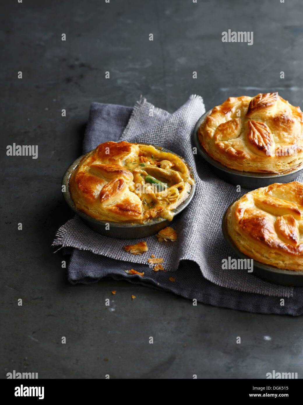 Still life of three chicken pies made with puff pastry Stock Photo