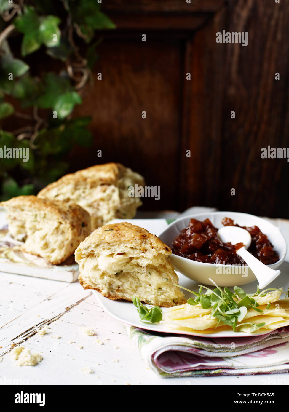 Savoury scones with spicy chutney and cheddar cheese Stock Photo