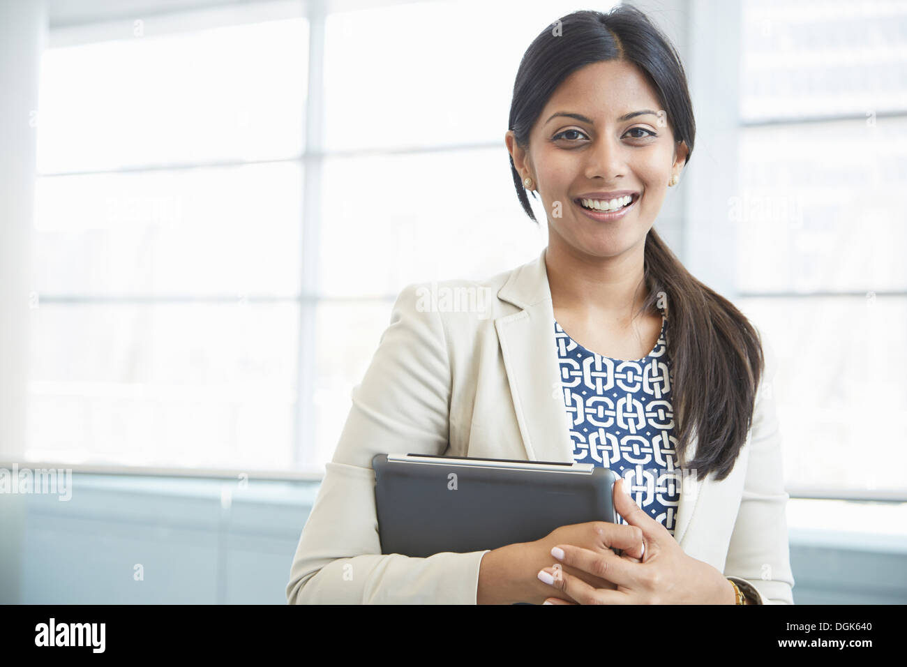 Businesswoman holding digital tablet Stock Photo