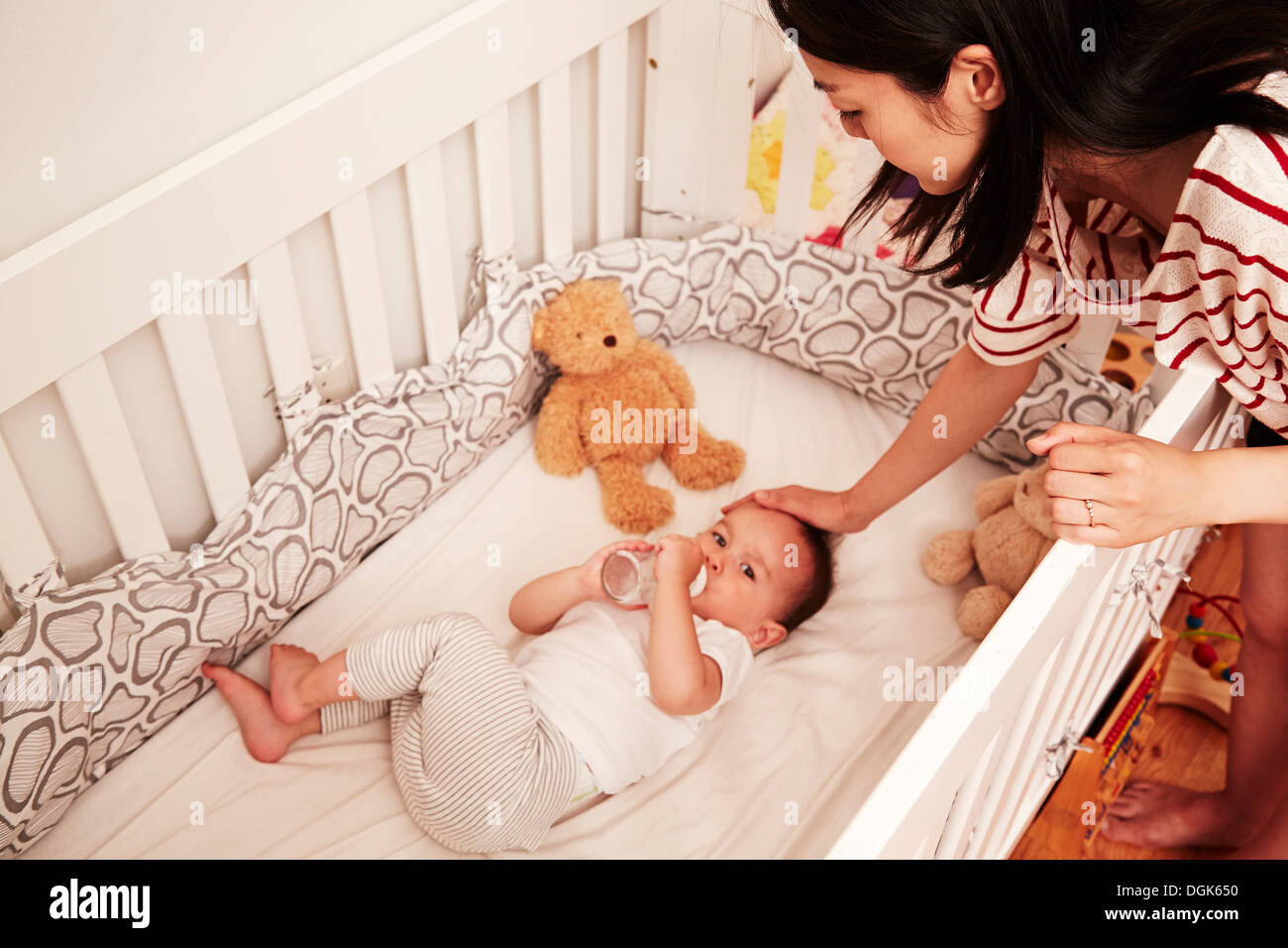 Baby Boy Lying In Crib Drinking Baby Bottle Stock Photo 61887532