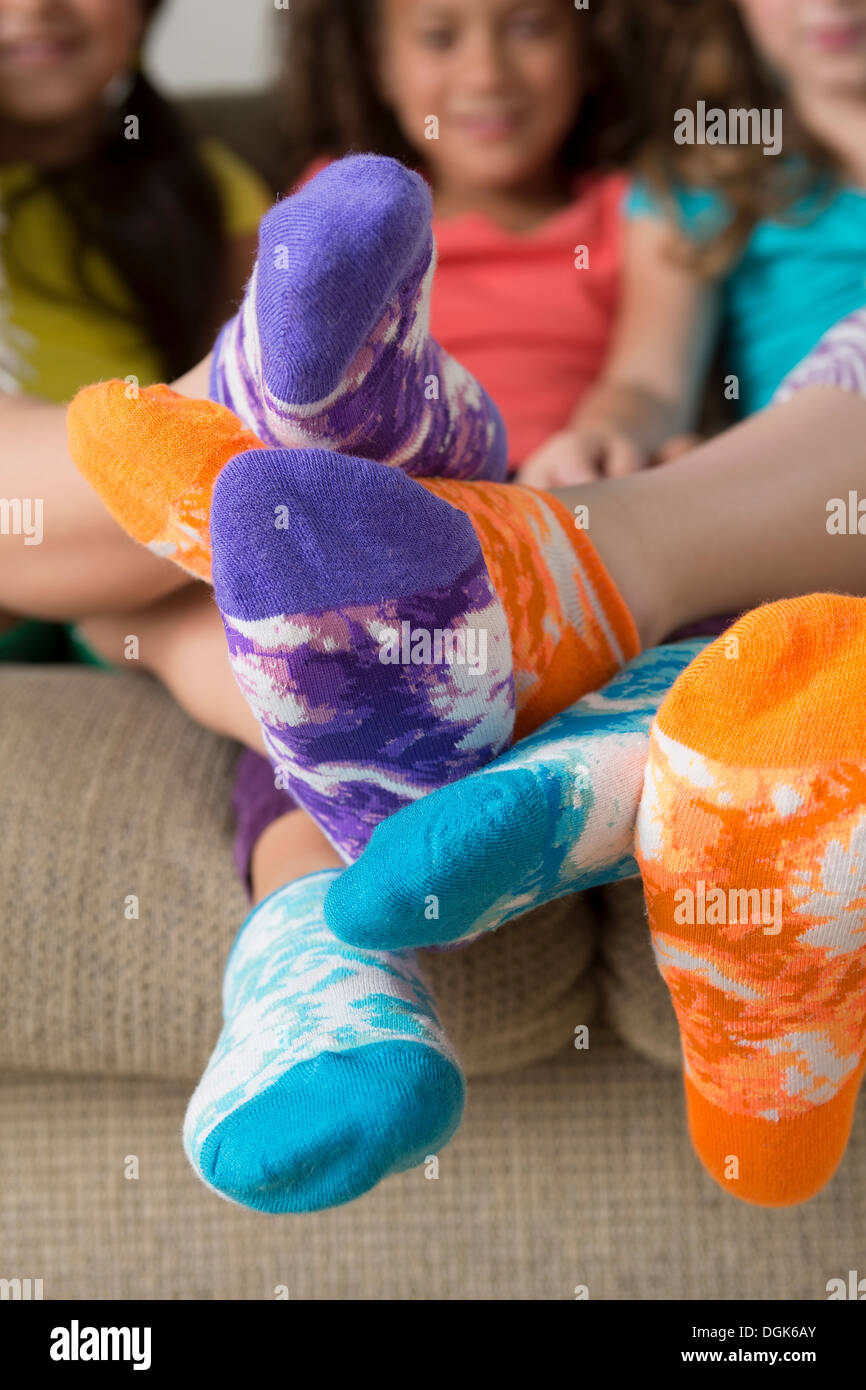 Girls wearing brightly coloured socks Stock Photo