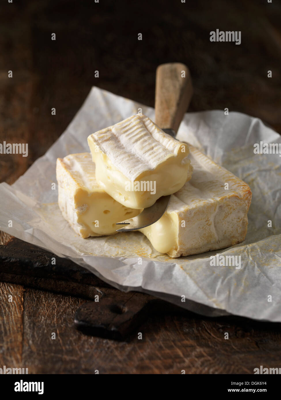 Still life with slice of pont l'eveque cheese Stock Photo