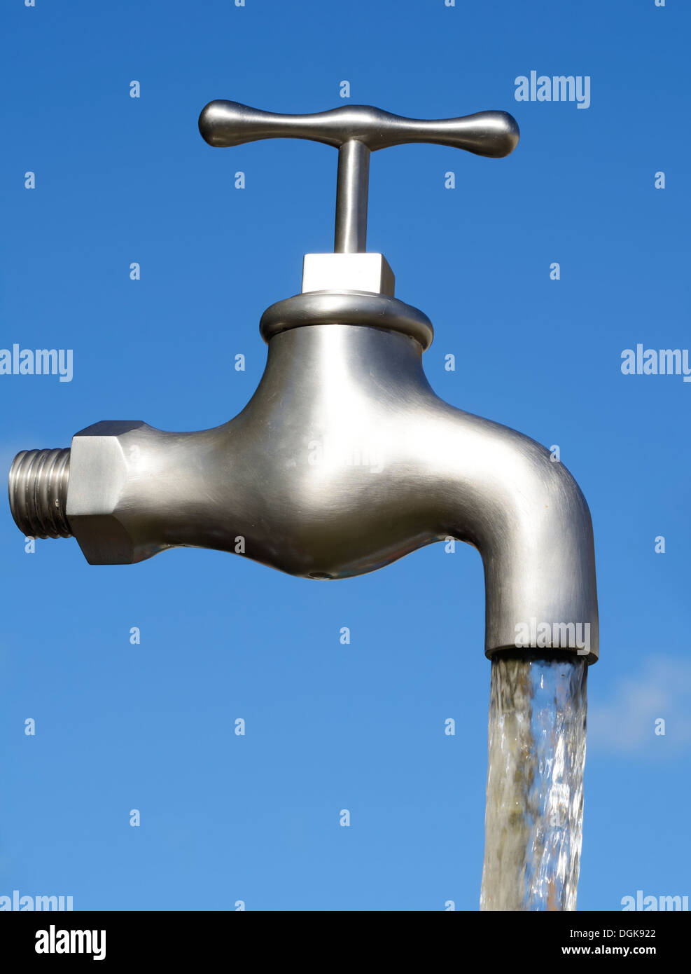 Illusion with a magic faucet and flowing water Stock Photo - Alamy