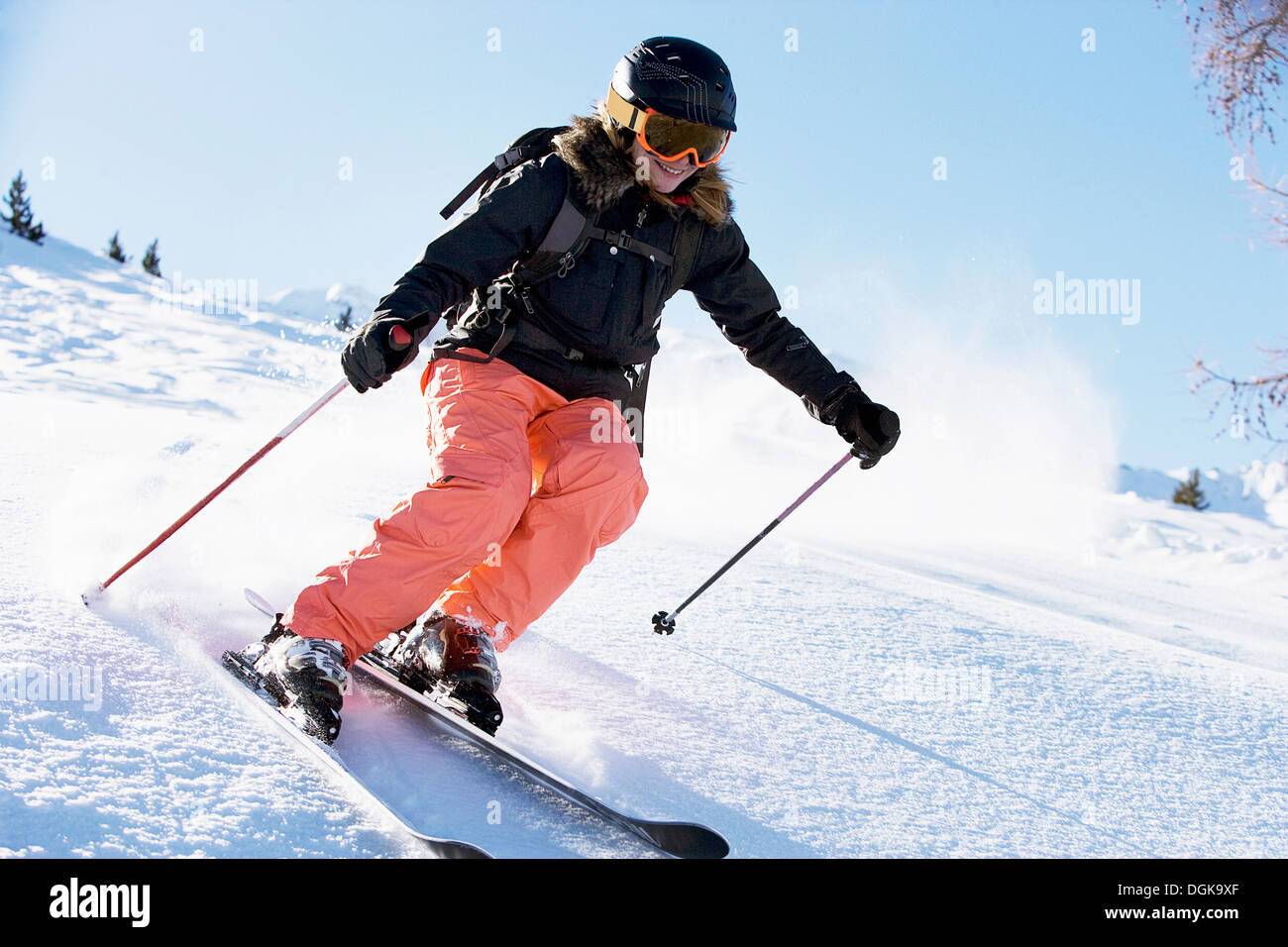 Female skiing downhill Stock Photo