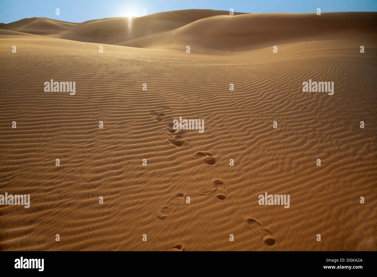Footsteps in the sand of the Dubai desert. Stock Photo