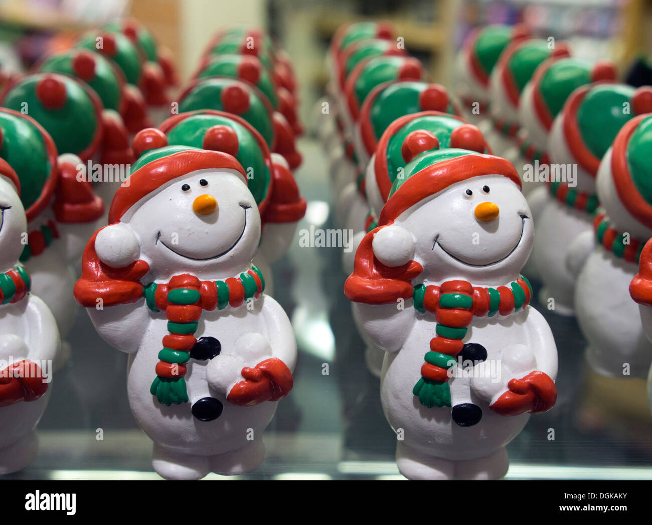 Edible snowman cake and tree decorations in a shop window at Oxford covered market. Stock Photo