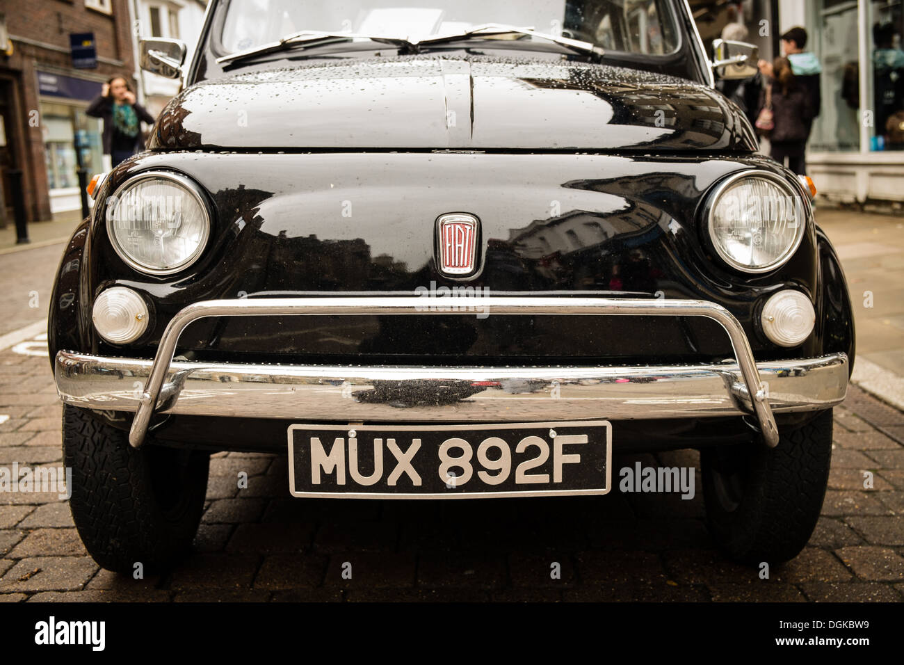 This image shows the front view of a classic Fiat 500 car. Stock Photo