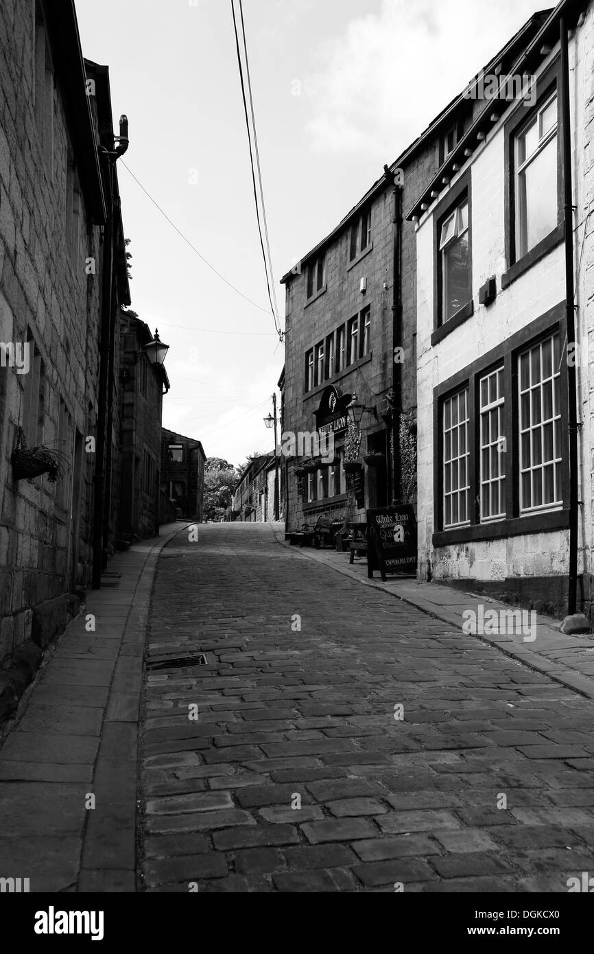 Narrow cobbled street, The White Lion pub, Heptonstall, West Yorkshire, England, UK Stock Photo