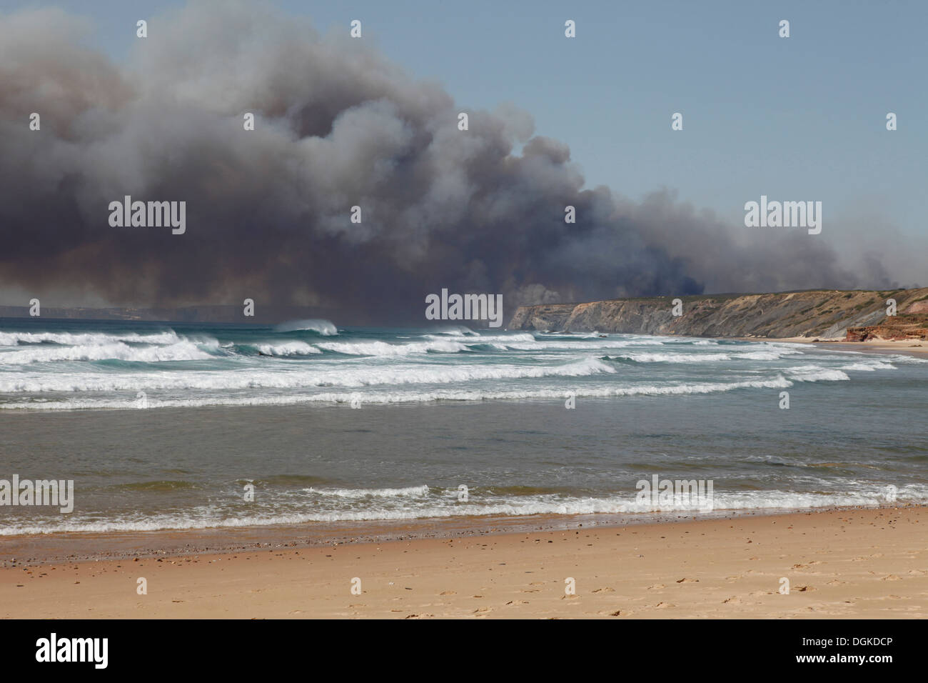 smoke rises over the atlantic ocean, bush fire, forest fire on the south west coast of portugal