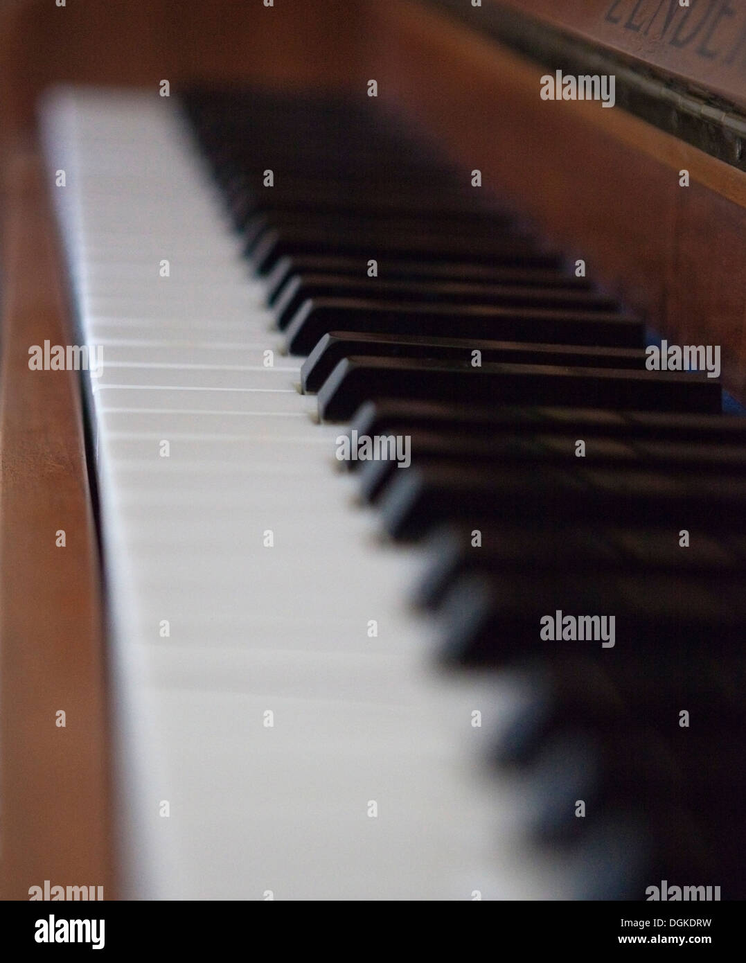 wooden upright piano keys detail with shallow depth of field Stock