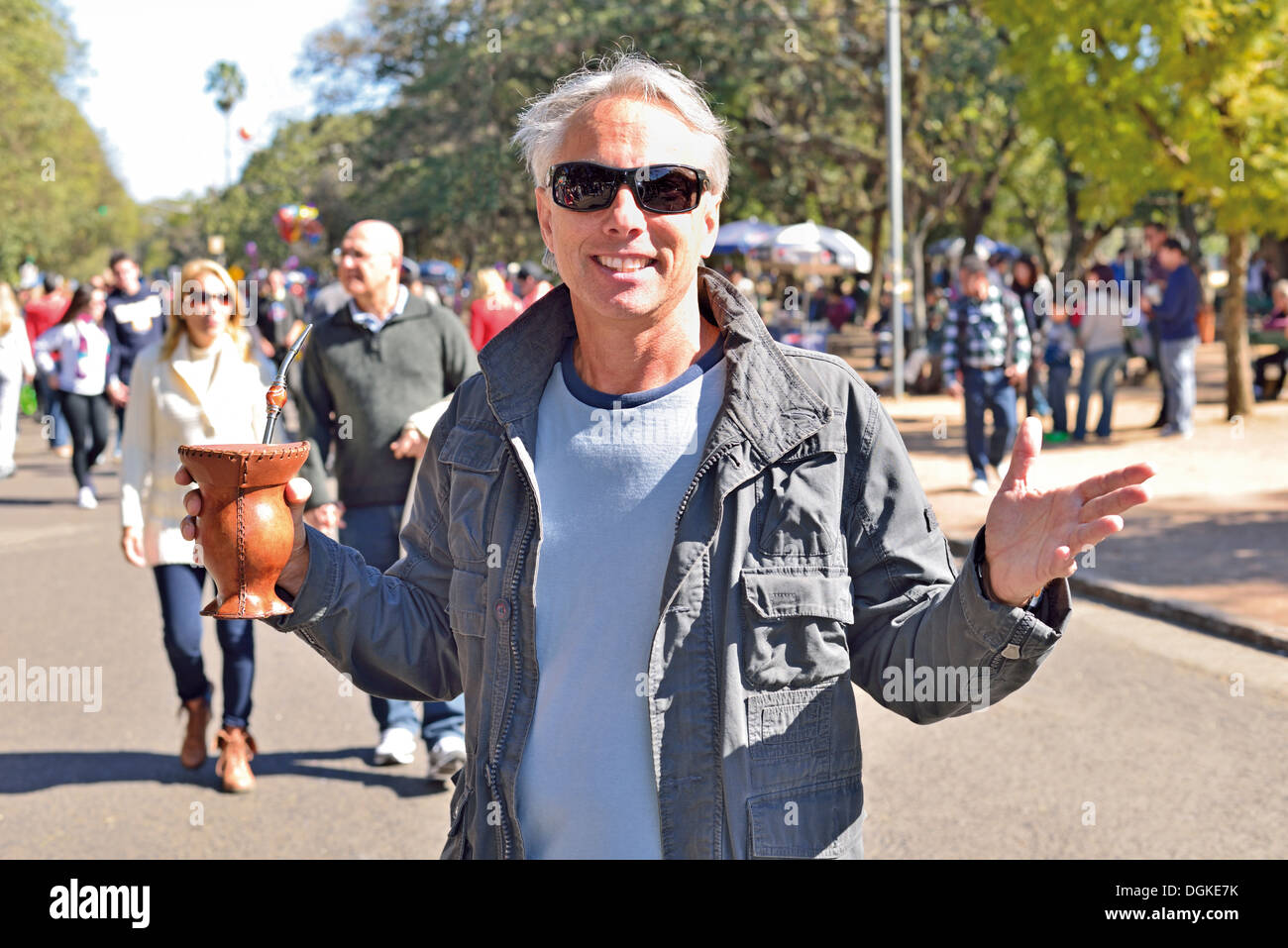 Brazil, Porto Alegre: Native inhabitant with a 'Chimarrao' at the Sunday morning flea market 'Brique da Redencao' Stock Photo