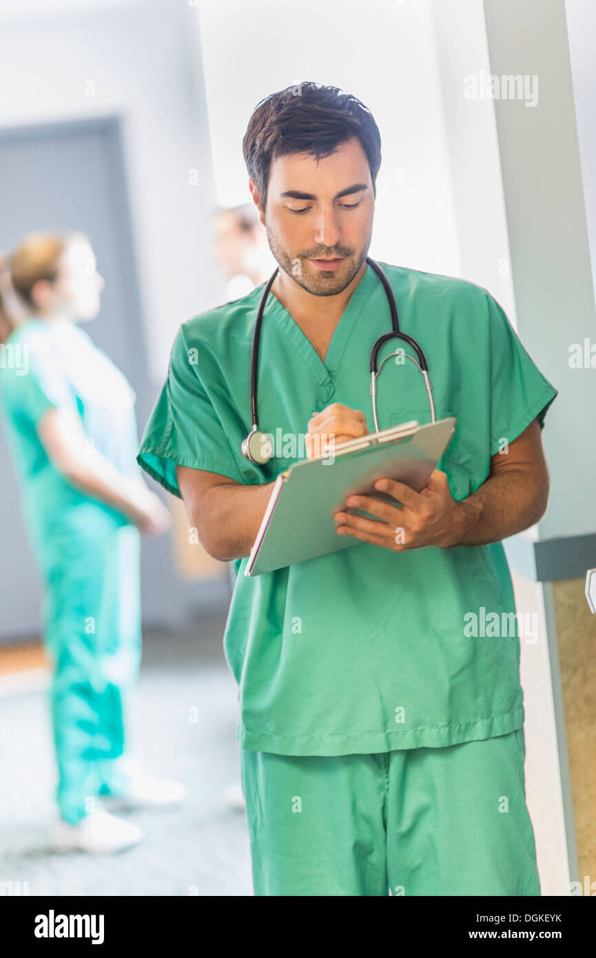 Male doctor in hospital hallway Stock Photo