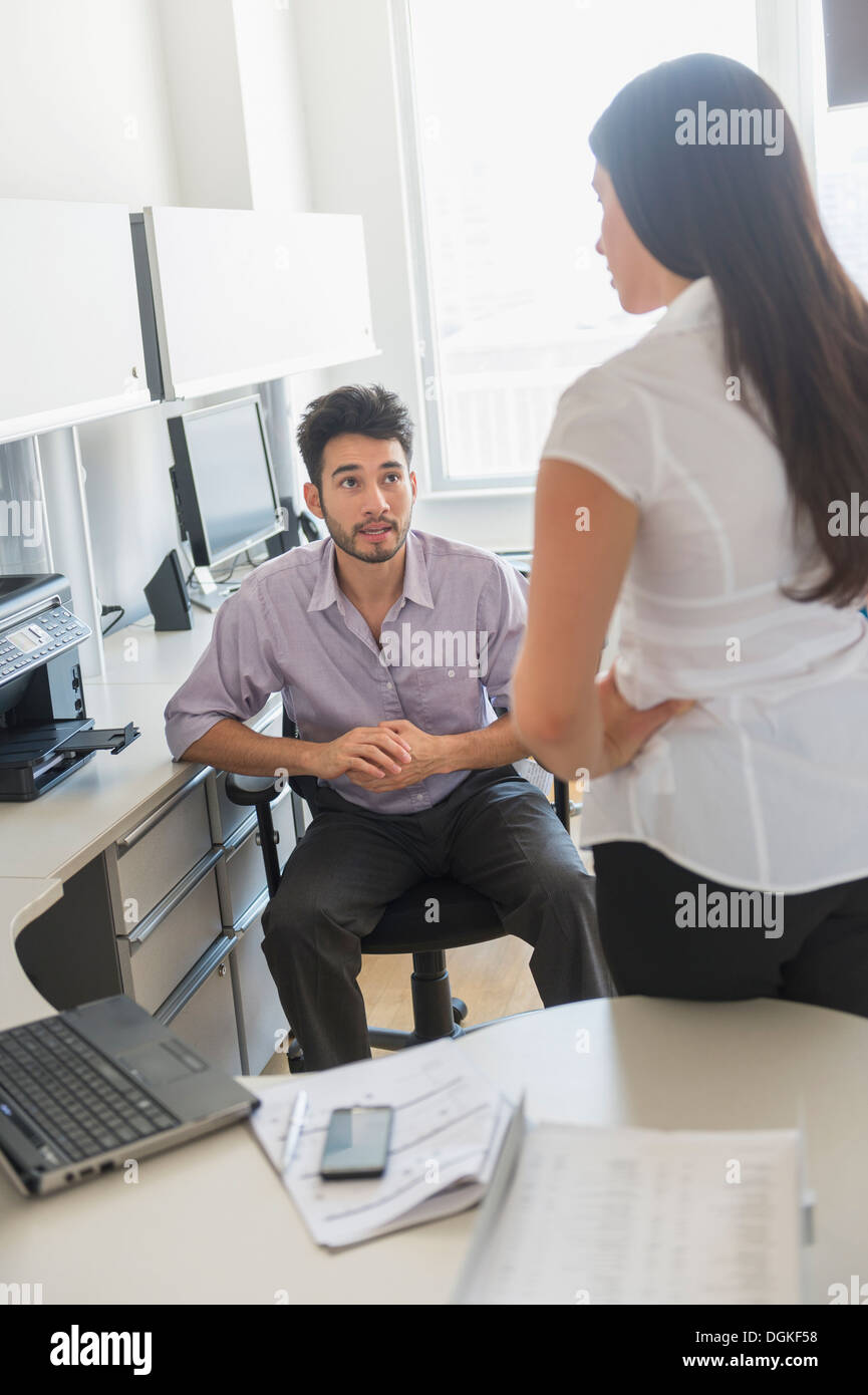 Business man and woman at work in office Stock Photo - Alamy