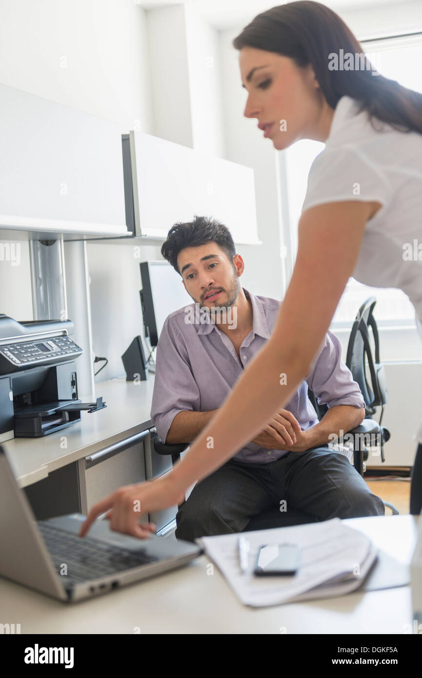 Business man and woman at work in office Stock Photo - Alamy