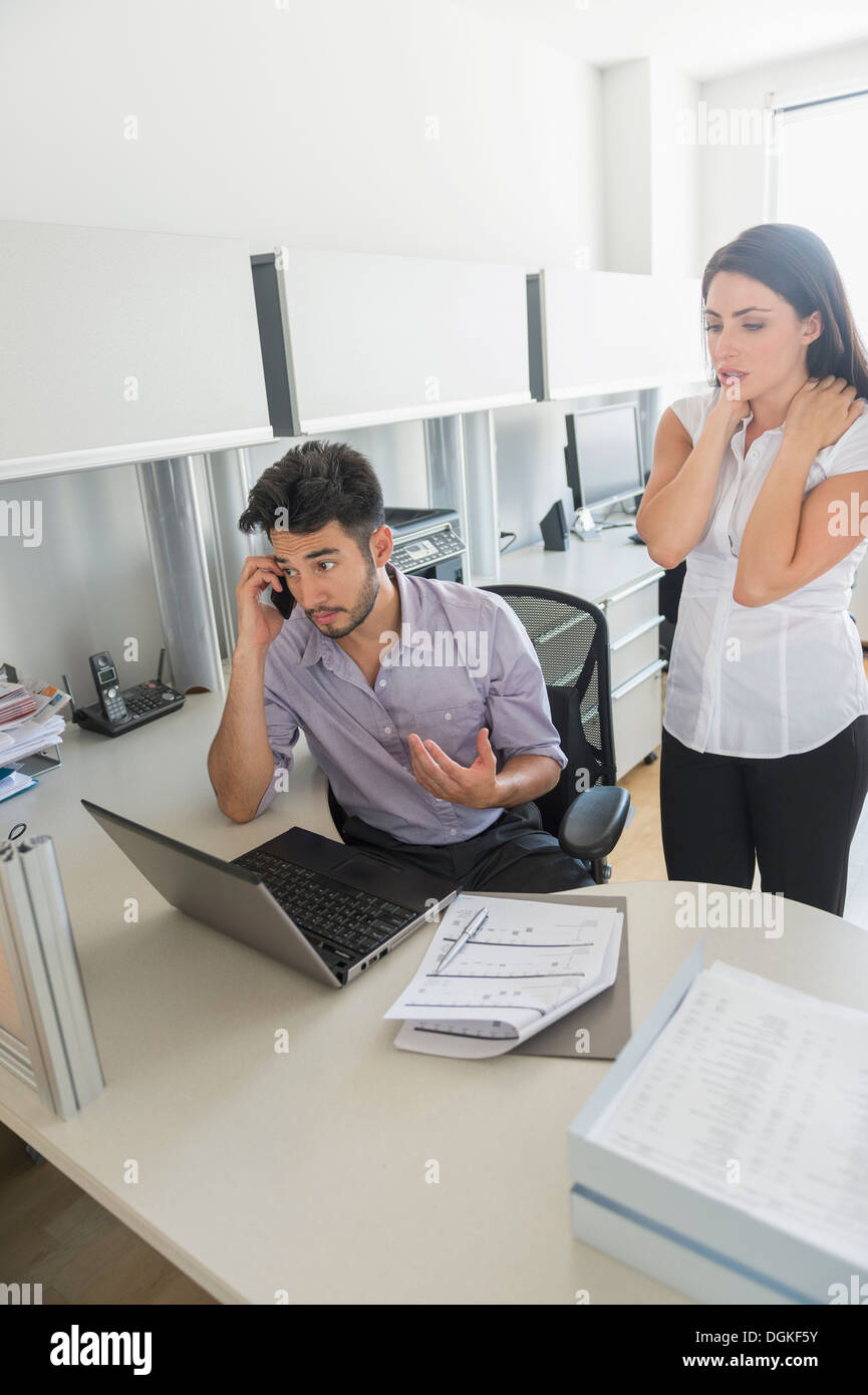 Business man and woman at work in office Stock Photo - Alamy