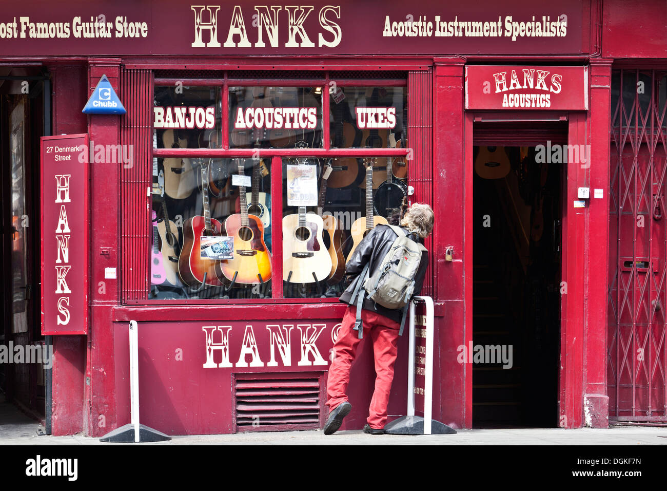 A man looking in the window of the famous Hanks guitar store. Stock Photo