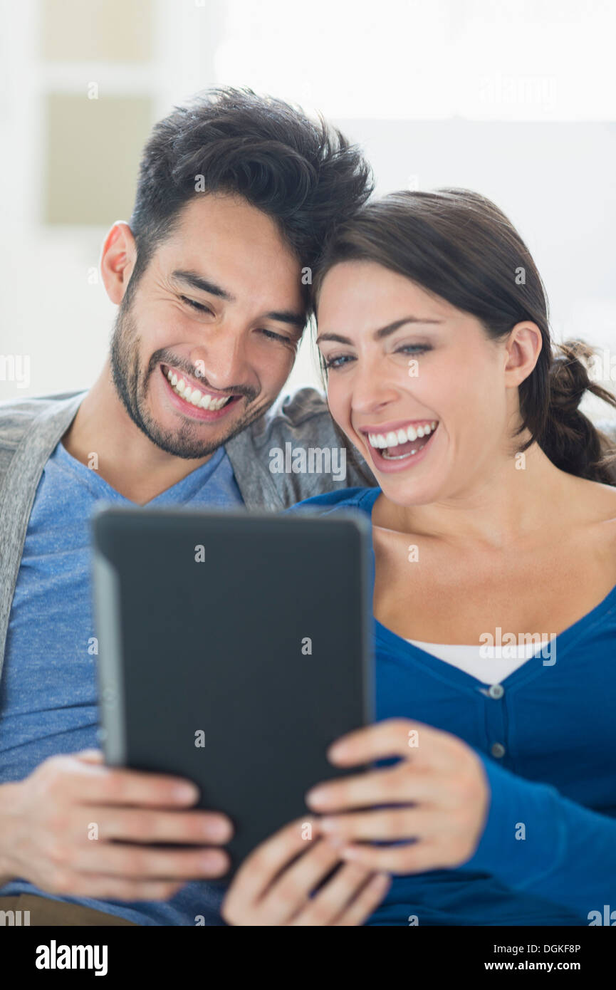 Couple using digital tablet Stock Photo
